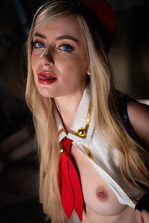 European blonde girl Emily Belle cosplays in a schoolgirl costume