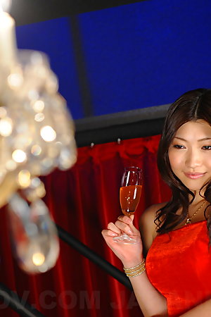 Arousing Karin Kusunoki poses in red dress