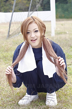 Long haired An Umemiya poses outdoor on field