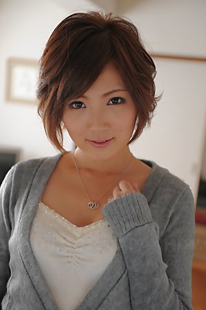 Kaede Oshiro with busy mouth shows sexy legs