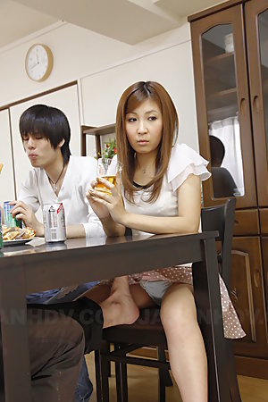 Hot Hitomi Okubo has pussy rubbed under table