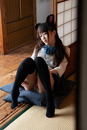 Sexy Japanese girl dressed as a schoolgirl masturbates alone