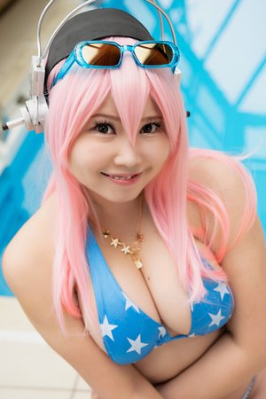 Japanese cosplayer Aisa Tamano poses naked by the pool