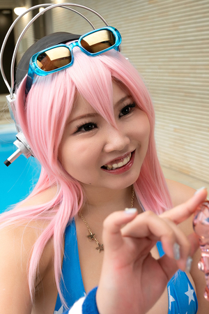 Big Titis Japanese cosplayer Aisa Tamano fucks herself between the tits with a transparent dildo